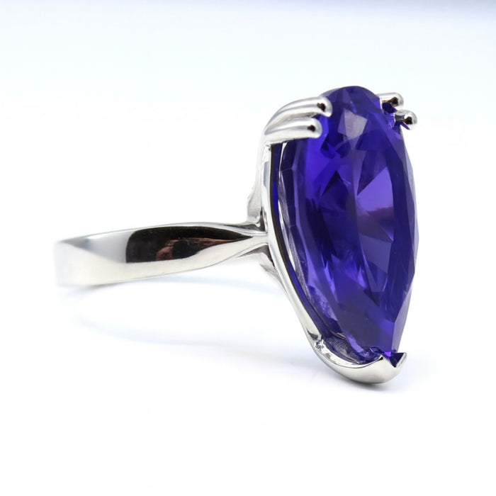 The Vesper Tanzanite — a 16 carat pear-cut vivid violet-blue tanzanite ring in hallmarked platinum by The Bardot Collection.